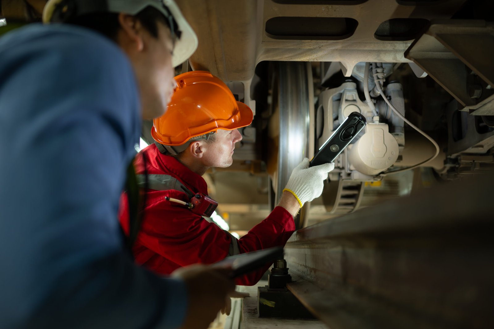 railway engineers inspecting train with flashlight 2026 03 16 04 25 57 utc scaled